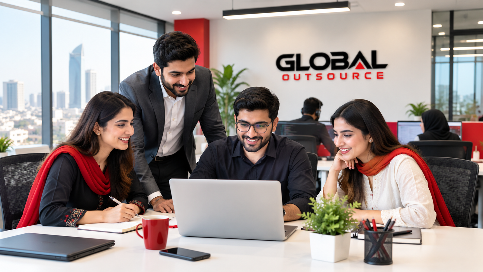Global Outsource's Pakistan-based team collaborating in their office